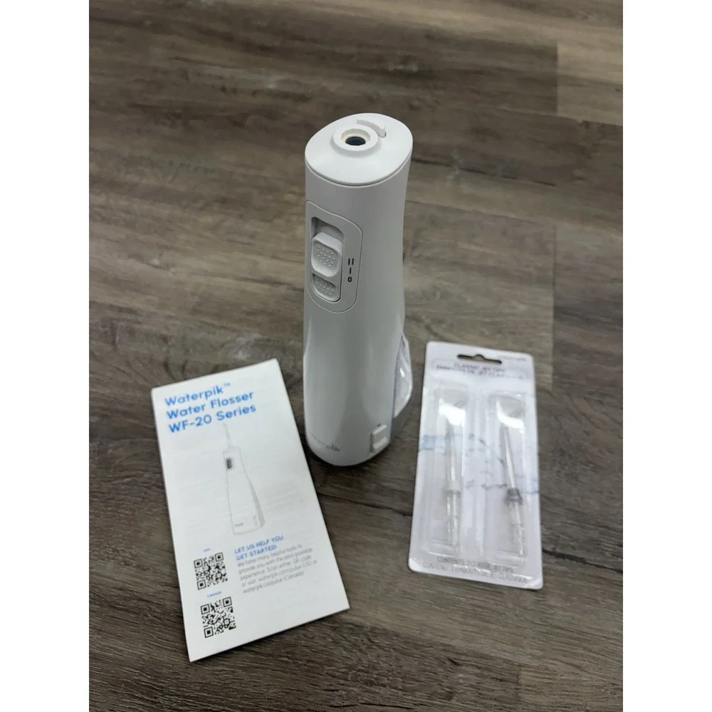 Waterpik Cordless Pulse 3100 Rechargeable Portable Water Flosser With 2 New Tips